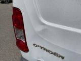 a close up of the rear end of a white van