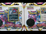 two packs of pokemon trading cards with a coin on top of them