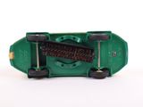 a green skateboard with a brush on top of it