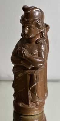 a chocolate figurine of a man holding a baby