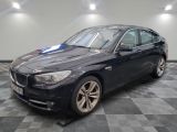 a picture of a black bmw car on a checkered floor