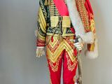 a toy soldier that is standing on a pedestal