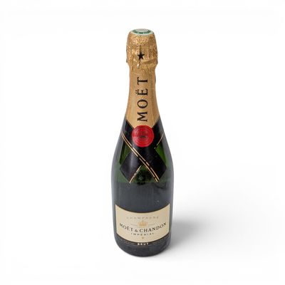 a close up of a bottle of champagne on a white background
