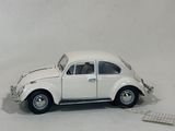 a toy car that is sitting on a white surface