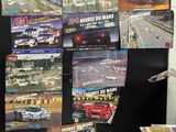 a bunch of posters on the wall of a room