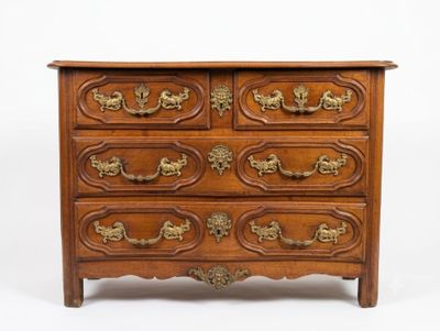 a wooden chest of drawers with gold handles on it