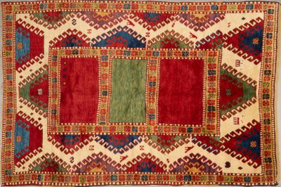 an old rug with a multicolored design on it