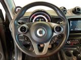 the interior of a car with a steering wheel and dashboard controls