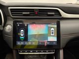 the interior of a car with a touch screen in the center