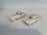 two toy cars that are sitting on a table