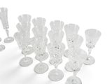 a lot of wine glasses that are sitting on the table