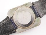 a close up of a watch on a white surface
