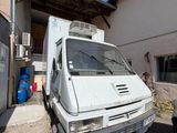 a white van that is parked in front of a building