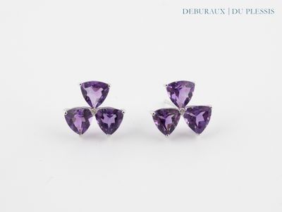 a pair of amethorate earrings with diamonds on a white background