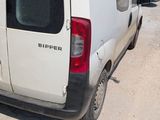 a white van that is parked on the side of the road