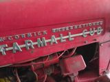 a close up of a red tractor with the word farmall on it
