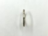 a close up of a diamond ring on a white surface