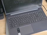 a laptop computer sitting on top of a wooden desk