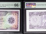three different types of currency are displayed in a display case