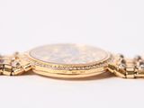 an image of a gold watch with a chain around it