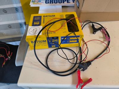 a table with a bunch of wires and a box on it