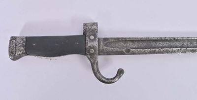 a close up of a knife on a white surface
