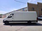 a white van that is parked in the parking lot