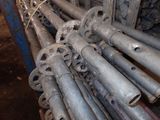 a lot of pipes that are stacked together in a pile