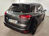 the rear of a black citrole parked in a garage