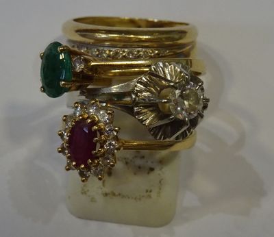 several rings are stacked on top of each other on a white surface