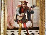 un tableau représentant un homme jouant de la guitare dans une pièce