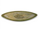 a green plate with a picture of a fish on it