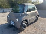 a small car that is parked in a parking lot
