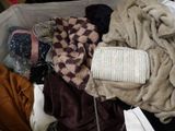 a suitcase full of clothes and a handbag in it
