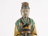 a statue of a man with a crown on his head