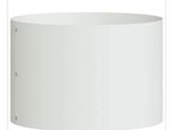 a close up of a white lamp shade on a table