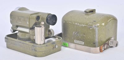 two old cameras sitting next to each other on a white surface