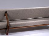 an image of a couch made of wood and fabric