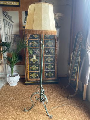a lamp that is on a stand in a room