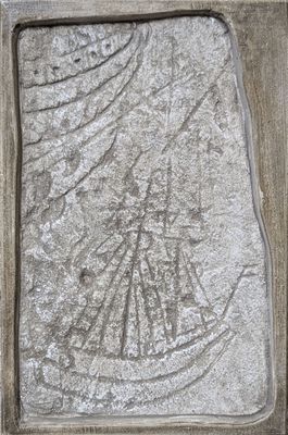 a picture of a ship carved into a stone block