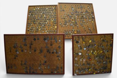 four pieces of wood with various types of buttons on them
