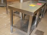 a table that has a yellow sticker on it in the middle of a kitchen