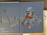 three books on the table with pictures of people in the snow