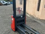 a close up of a forklift parked in front of a building