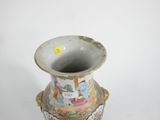 a vase that is sitting on a white surface