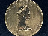 une image montrant un gros plan d'une pièce de monnaie sur laquelle figure le visage d'une femme