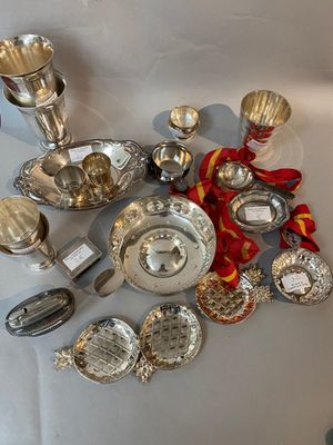 a lot of silver items that are on the table