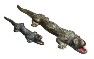 pair of metal alligator figurines on a white background