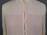 an image of a woman ' s blouse on a mannequin dummy