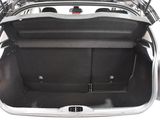 the back of a car with its trunk open and luggage in the trunk